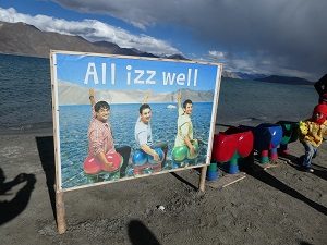 Pangong lake and a movie billboard