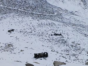 Army trucks knocked down in an avalanche