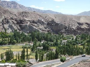 River valley village and palace above