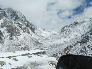 Snow in the valley below Chang La Pass