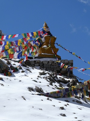 Prayer flags adorn the small stupa on Khardung La Pass