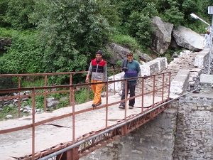 Suresh and our guide returning from being 'lost' in the Valley of Flowers, India 2006