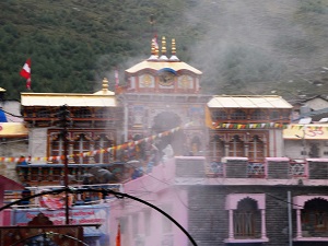 Steam rises from the natural hot springs in front of Badrinath Temple, Badrinath, Himalayas India