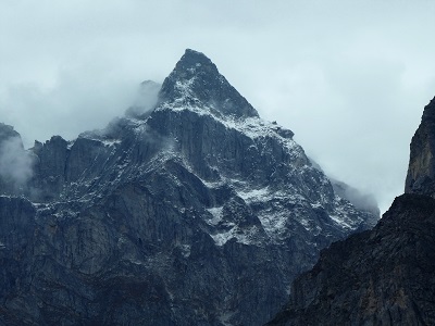 Stunning peak amongst the mist near Badrinath and Mana Village, Himalayas India