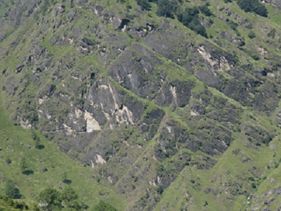 The ancient pilgrim trail on the rock wall above the deep valley - on the way back from Badrinath. Himalayan India