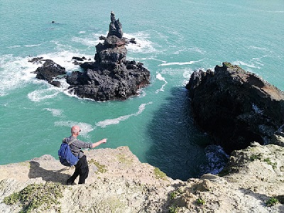 Manfred pointing out a good lunch spot near Baoz Rock Stack, Banks Peninsula, Canterbury, New Zealand