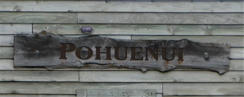 Pohuenui sign on the wall of the shed near the wharf