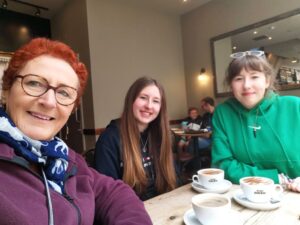 Teresa with my granddaughters having coffee in a local cafe