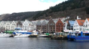 Heritage buildings and modern boats in Bergen's Bryggen Wharf