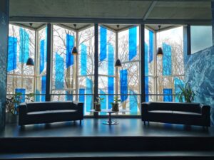 Stained glass windows looking out onto the fjord from Bergen Aquarium