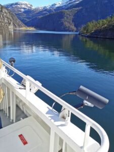 The calm waters of the fjord as we sight Mostraumen up ahead