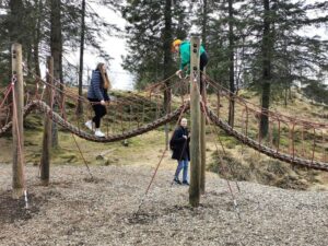 Tor and the twins getting into more difficult territory in the adventure playground Mt Fløyen
