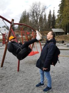 Tor playing with the girls in the playground on Mt Fløyen