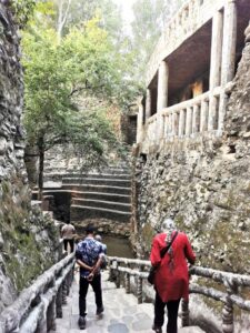 Strolling down a stairway to a pond in the Rock Garden Chandigarh