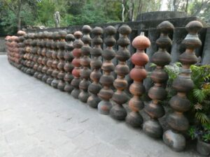 Terracota water pots used in a creative sculpture at Rock Garden Chandigarh