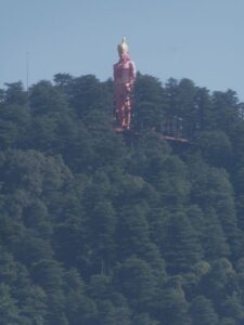 The Hanuman statue rising out of the trees on Jakhu Hill above Shimla