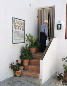 A local man enters his house after a chat in Spanish with Manfred in Frigiliana