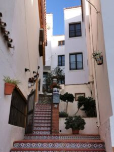 A narrow tiled stepped walkway in Iznate