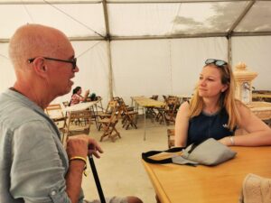 Manfred and Hana chatting at Karma Guen in the dining tent