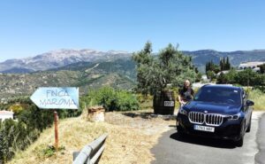 Manfred by the car above the Bodega and a local finca a farmhouse
