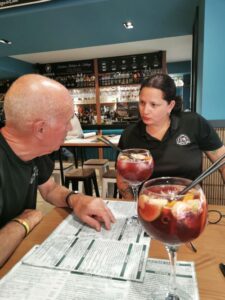 Manfred discussing the menu with one of the staff at Cruza la Calle who had made the amazing Sangria!