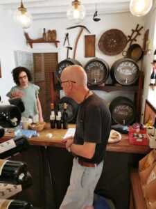 Manfred discussing wine with the lady in the Tienda De Vinos Almijara wine shop
