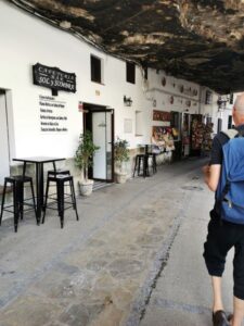 A cafe in the cave house area, note the charred roof from centuries of fires. Setenil de las Bodegas