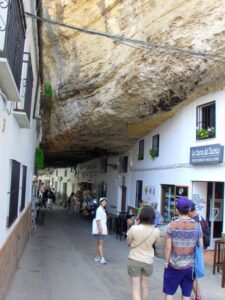 An alleyway of cave houses, shops and restaurant in Setenil de las Bodegas