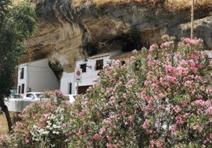 Cave houses and colourful flowers in Setenil de las Bodegas