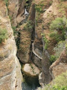 From Mirador de Aldehuela down to the valley floor with the walkways around the cliffs