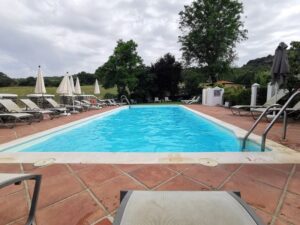 The lovely swimming pool by the rural fields at Cortijo Las Piletas