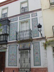 A building in La Plaza Ubrique decorated with mosaic tiles