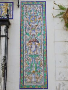 A closeup of the mosaic tiling on the building in La Plaza Ubrique