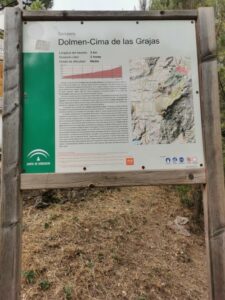 A signboard indicating the track to the Dolmen del Giganta and the Cima de las Grajas beyond