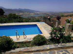 Across the pool at El Taho towards the embalse, Zahara de la Sierra and the hills beyond