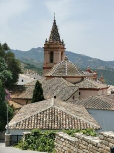 Across the roofs towards the Iglesia de Santa Maria de la Mesa (Church of St Mary) Zahara de la Sierra from the street to the castle track entrance