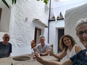 Enjoying some wine and a chat with fellow guests at the 'Mountain Guest House', Casa De Los Cuadros, Villaluenga del Rosario