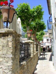 Juliet balconies of homes alongside the Plaza de España Grazalema