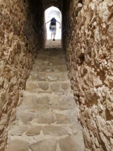 Manfred climbing the narrow steep stairs to the top of the castle on the hill Zahara de la Sierra