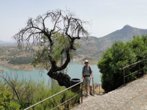 Manfred on the track to the Castle on the hill Zahara de la Sierra. The embalse and Tajo Algarín beyond