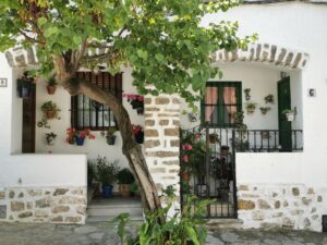 Side by side colourful front porch's in the white village of Grazalema
