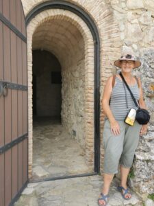 Teresa at the door to the castle on the hill Zahara de la Sierra