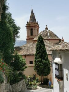 The Iglesia de Santa Maria de la Mesa (Church of St Mary) Zahara de la Sierra from the street to the castle track entrance