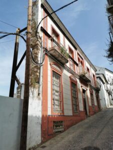 The facade of a building under renovation in Ubrique