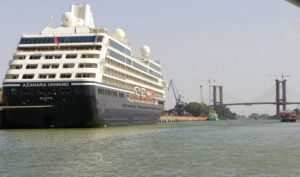 A cruise ship on the Canal de Alfonso XIII, Guadalquivir River and the bridge beyond
