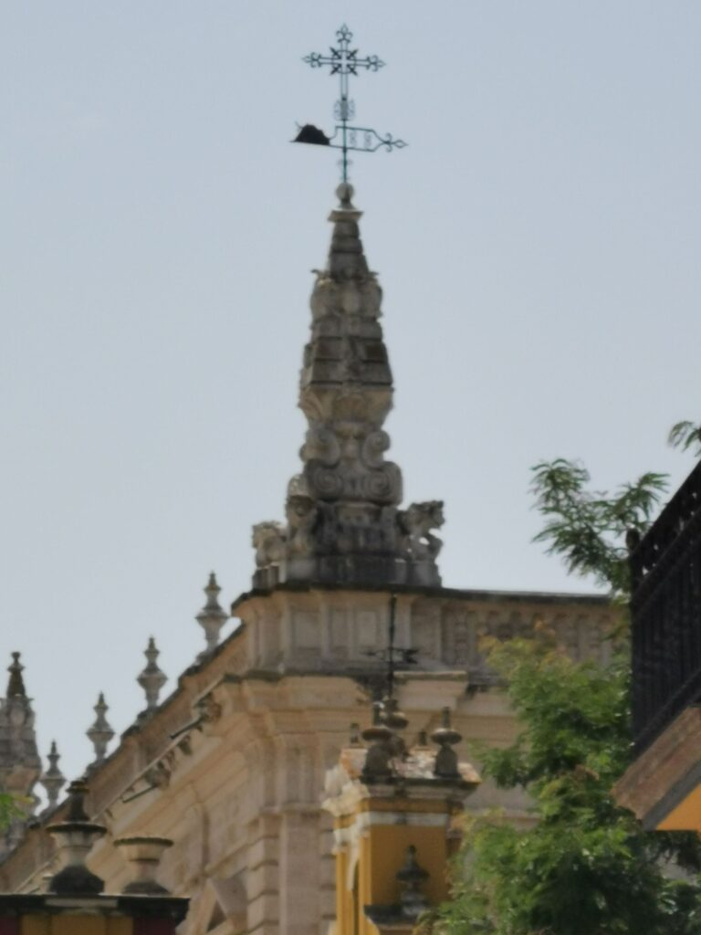 A wind vane on a corner tower of the Real Alcázar