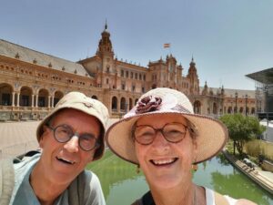 Manfred and Teresa on the bridge over the canal at Plaza de España with the concert stage to the right
