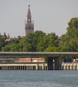 The Cathedral and the Giralda as seen from Canal de Alfonso XIII on the Guadalquivir River