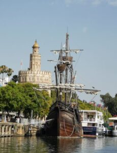 The replica Galleon and the Torre del Oro on the Seville river bank