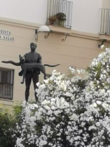 This is a statue of Trajan holding the She-Wolf, symbol of Rome overlooking the Guadalquivir from its south bank.